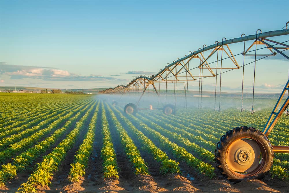Close up of tractor component fertilizing crops