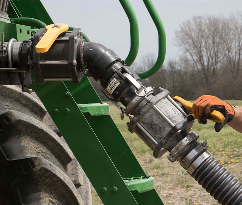 Banjo liquid handling valve installed on agricultural equipment, highlighting valve handle clearance and accessibility for OEM equipment design.